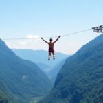 Bungee jumper soaring above green mountains and blue sky.