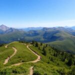 Hikers on a trail in a beautiful mountain landscape.