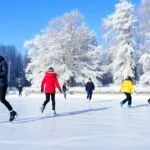 Beginners ice skating on a frozen rink outdoors.