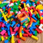 Colorful LEGO bricks on a wooden table with a structure.